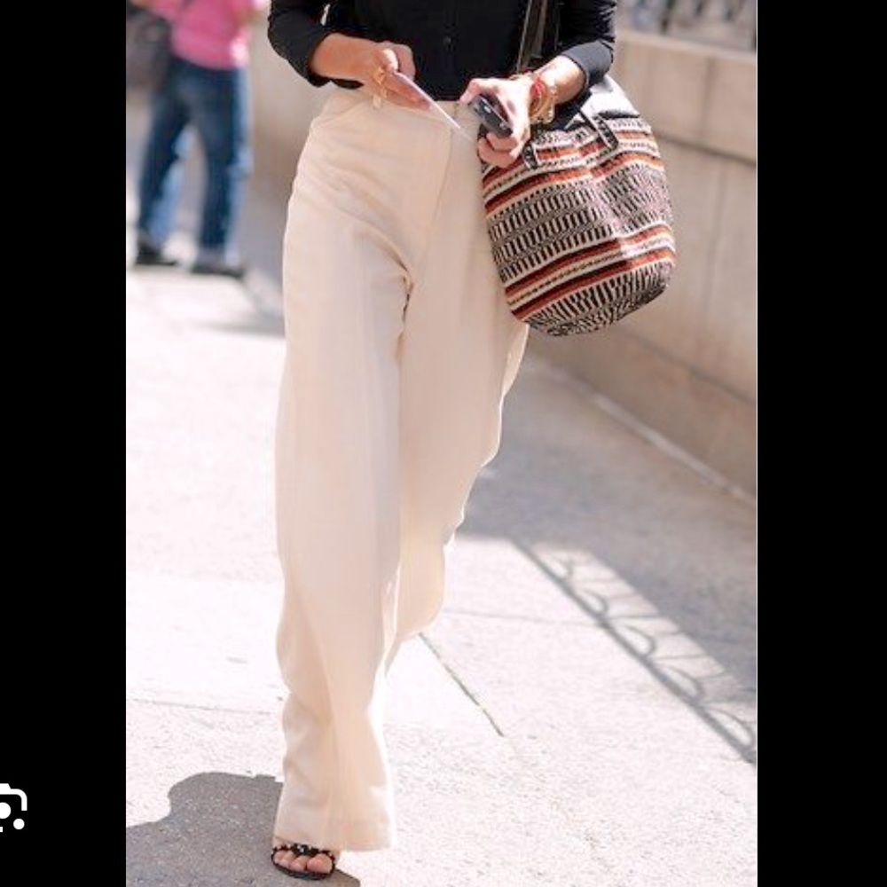 Cream fully lined wide leg trousers with wide waist band size 31” waist